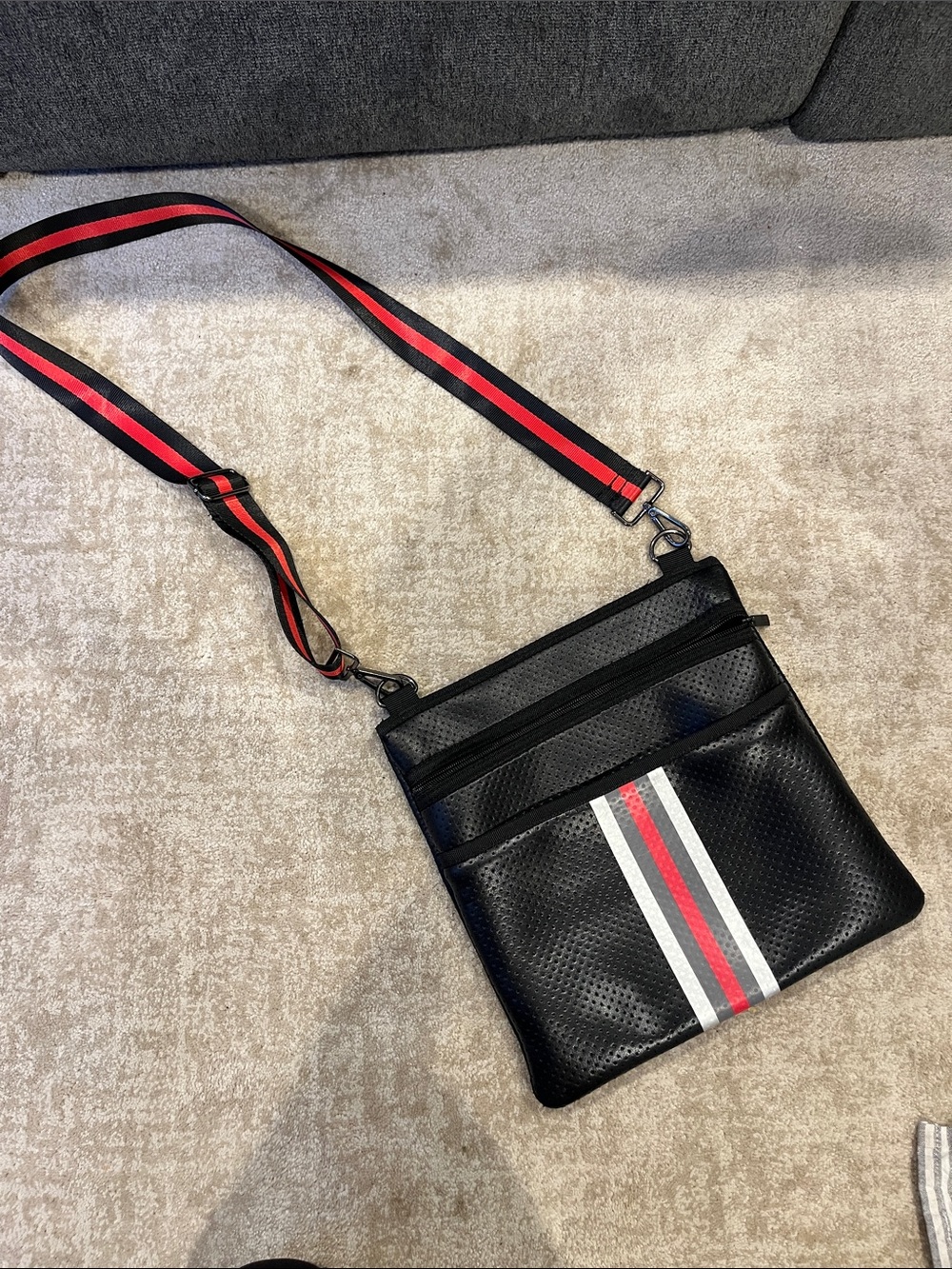 HAUTE SHORE Black Crossbody with Red & White Stripe
